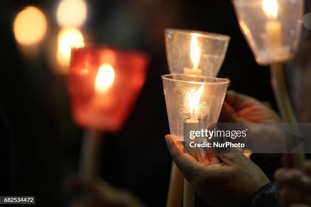 Pilgrims hold candles at the Apparitions Chapel before the traditional candle procession at Fatima's Sanctuary, Leiria, Portugal, 12 May 2017. Pope...