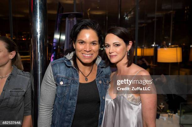 Women's bantamweight champion Amanda Nunes poses for a photo with Kingdom star Joanna Going during the UFC 211 Kingdom Pre-Party at Savor Gastropub...