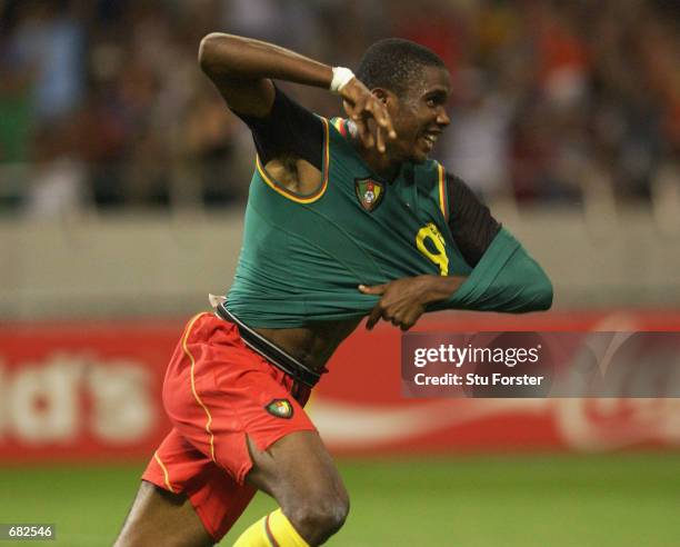 Samuel Eto'o of Cameroon celebrates after scoring the opening goal of the match during the FIFA World Cup Finals 2002 Group E match between Cameroon...