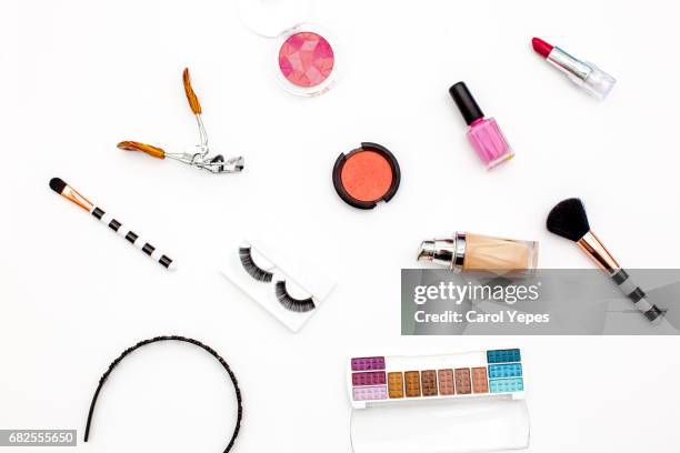 various makeup products and cosmetics in white background.top view - lip balm stock-fotos und bilder