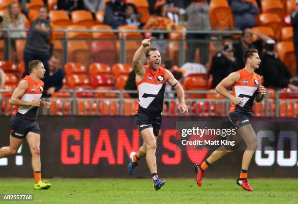 Steve Johnson of the Giants celebrates kicking the winning goal during the round eight AFL match between the Greater Western Sydney Giants and the...