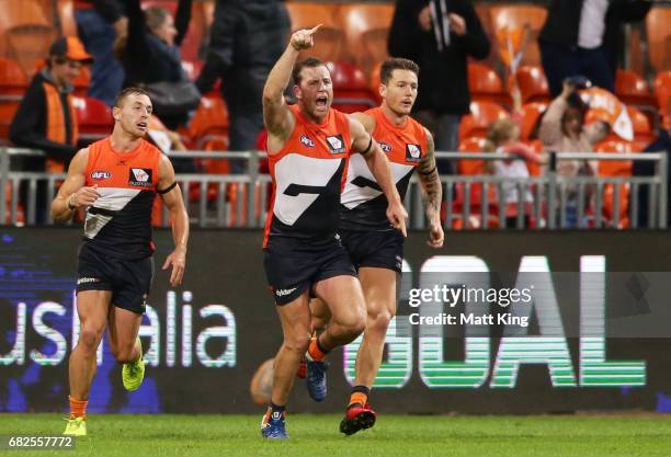 Steve Johnson of the Giants celebrates kicking the winning goal during the round eight AFL match between the Greater Western Sydney Giants and the...