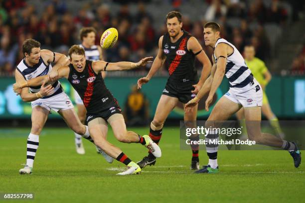 Patrick Dangerfield of the Cats tackles Brendon Goddard of the Bombers during the round eight AFL match between the Essendon Bombers and the Geelong...