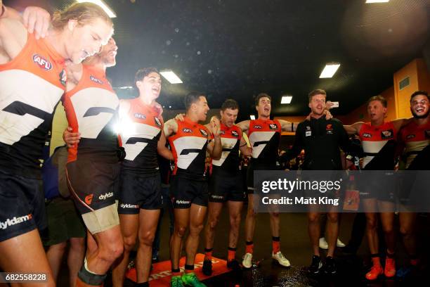 Giants celebrate victory and sing the team song after the round eight AFL match between the Greater Western Sydney Giants and the Collingwood Magpies...