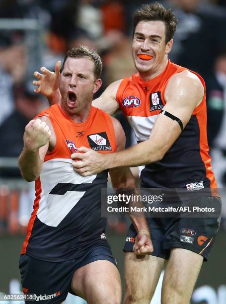 Steve Johnson of the Giants celebrates with team mate Jeremy Cameron after kicking the winning goal during the round eight AFL match between the...