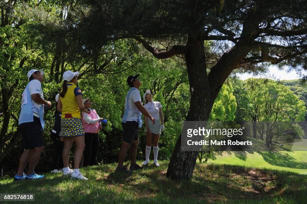 Shin-Ae Ahn of South Korea attempts to identify her ball that has become stuck in a tree on the 6th hole during the second round of the...