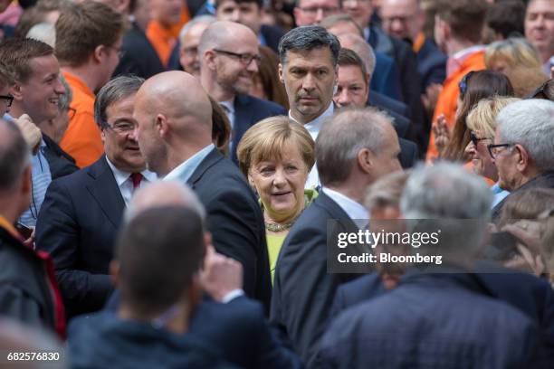 Angela Merkel, Germany's chancellor and Christian Democratic Union leader, center, and Armin Laschet, deputy chairman of the CDU and candidate for...