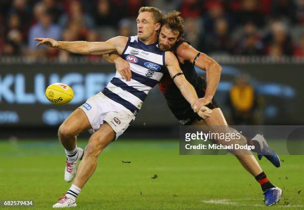 Jobe Watson of the Bombers tackles Joel Selwood of the Cats during the round eight AFL match between the Essendon Bombers and the Geelong Cats at...