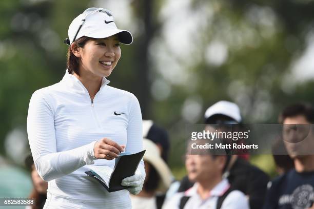 Rumi Yoshiba of Japan smiles before her tee shot on the 10th hole during the first round of the Hoken-no-Madoguchi Ladies at the Fukuoka Country Club...