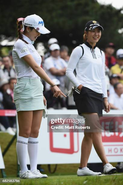 Shin-Ae Ahn of South Korea shares a laugh with Ayaka Matsumori of Japan before her tee shot on the 10th hole during the first round of the...