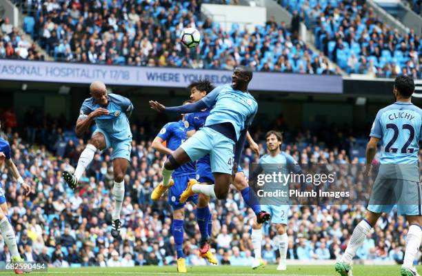 Shinji Okazaki of Leicester City in action with Yaya Toure of Manchester City during the Premier League match between Manchester City and Leicester...