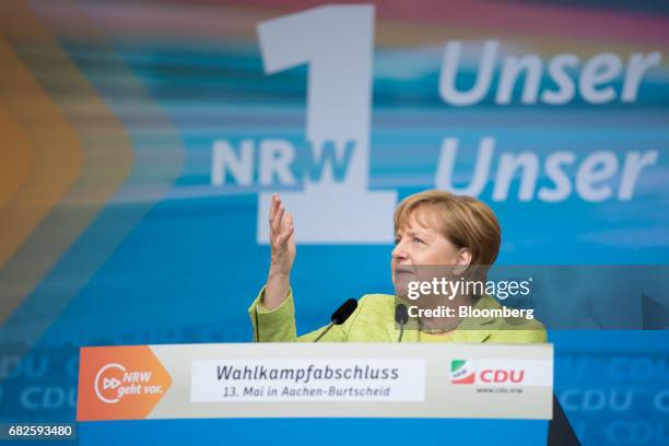 Angela Merkel, Germany's chancellor and Christian Democratic Union leader, gestures while speaking during a campaign event in Aachen, Germany, on...