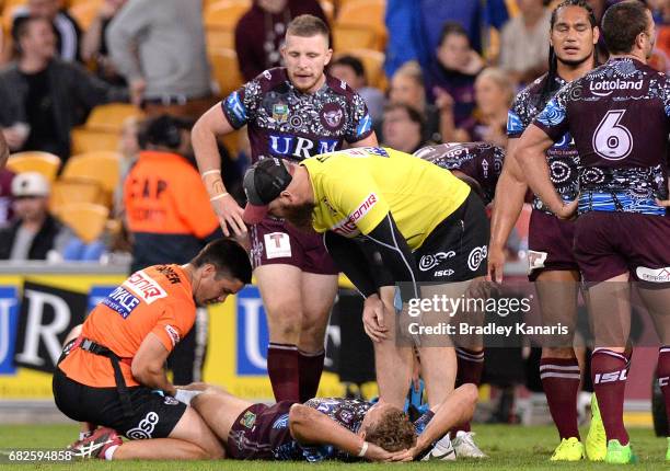 Tom Trbojevic of the Sea Eagles is injured during the round 10 NRL match between the Manly Sea Eagles and the Brisbane Broncos at Suncorp Stadium on...