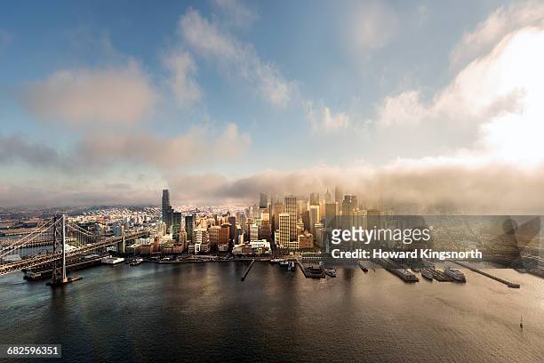 port of san francisco shrouded in fog, aerial view - skyline san francisco stock-fotos und bilder