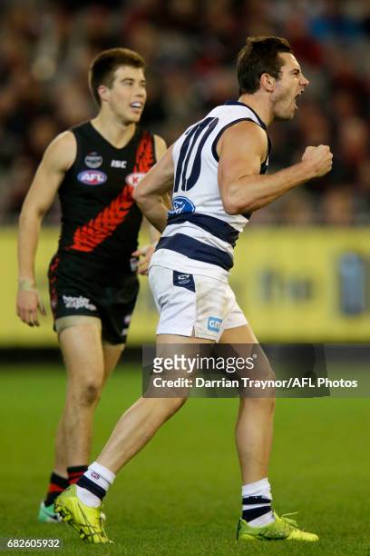 Daniel Menzel of the Cats celebrates a goal during the round eight AFL match between the Essendon Bombers and the Geelong Cats at Melbourne Cricket...
