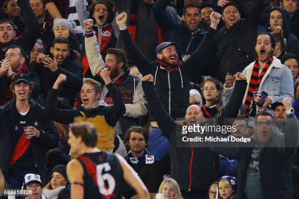 Joe Daniher of the Bombers celebrates a goal with Bombers fans during the round eight AFL match between the Essendon Bombers and the Geelong Cats at...