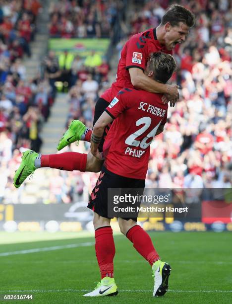 Maximilian Philipp of Freiburg celebrates with his team-mate Florian Niederlechner of Freiburg after scoring his team's first goal during the...
