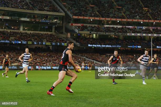 David Myers of the Bombers runs with the ball during the round eight AFL match between the Essendon Bombers and the Geelong Cats at Melbourne Cricket...