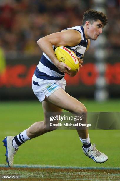 Mark O'Connor of the Cats runs with the ball during the round eight AFL match between the Essendon Bombers and the Geelong Cats at Melbourne Cricket...