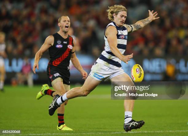 Tom Stewart of the Cats kicks a goal during the round eight AFL match between the Essendon Bombers and the Geelong Cats at Melbourne Cricket Ground...
