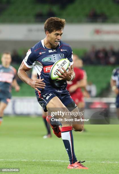 Ben Volavola of the Rebels runs with the ball during the round 12 Super Rugby match between the Melbourne Rebels and the Queensland Reds at AAMI Park...