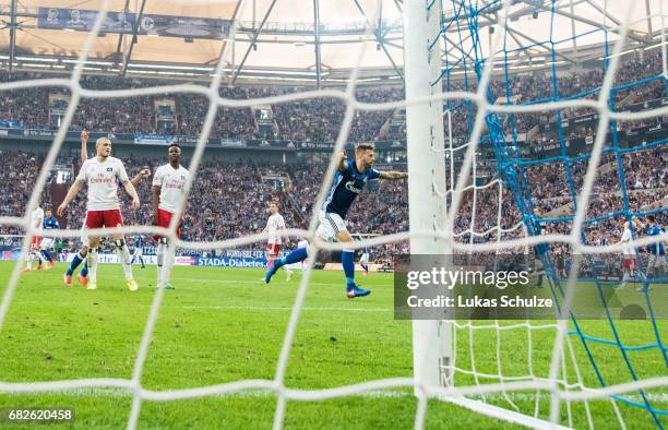 Guido Burgstaller celebrates his teams first goal during the Bundesliga match between FC Schalke 04 and Hamburger SV at Veltins-Arena on May 13, 2017...