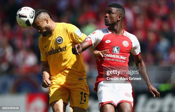 Michael Hector of Frankfurt is challenged by Jhon Cordoba of Mainz during the Bundesliga match between 1. FSV Mainz 05 and Eintracht Frankfurt at...