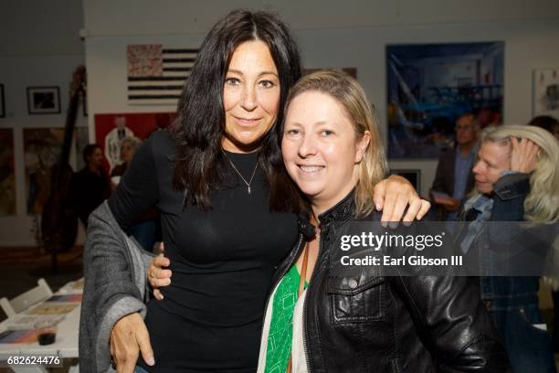 Terry Apple and Zuzana Korda attend the Malibu Guitar Festival Gallery Opening Reception at Malibu Village on May 12, 2017 in Malibu, California.