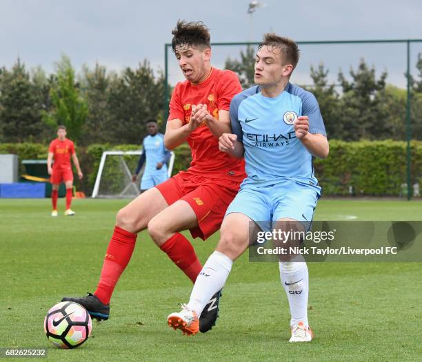 Anthony Glennon of Liverpool and Luke Bolton of Manchester City in action during the Manchester City v Liverpool U18 Premier League game at Etihad...