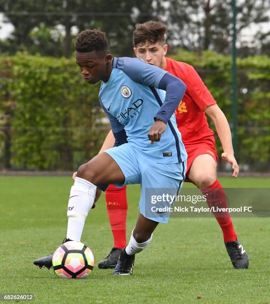 Anthony Glennon of Liverpool and Rabbi Matondo of Manchester City in action during the Manchester City v Liverpool U18 Premier League game at Etihad...