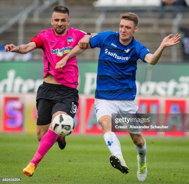 Vedad Ibisevic of Hertha BSC challenges Patrick Banggaard of Darmstadt during the Bundesliga match between SV Darmstadt 98 and Hertha BSC at Stadion...