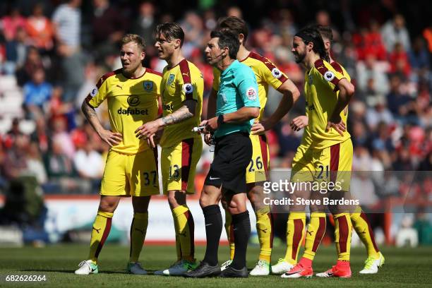 Refere Lee Probert speaks to the Burnley team during the Premier League match between AFC Bournemouth and Burnley at Vitality Stadium on May 13, 2017...