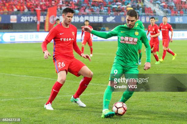 Jonathan Soriano of Beijing Guoan and Richard Guzmics of Yanbian Fude FC compete for the ball during the 9th round match of 2017 Chinese Football...