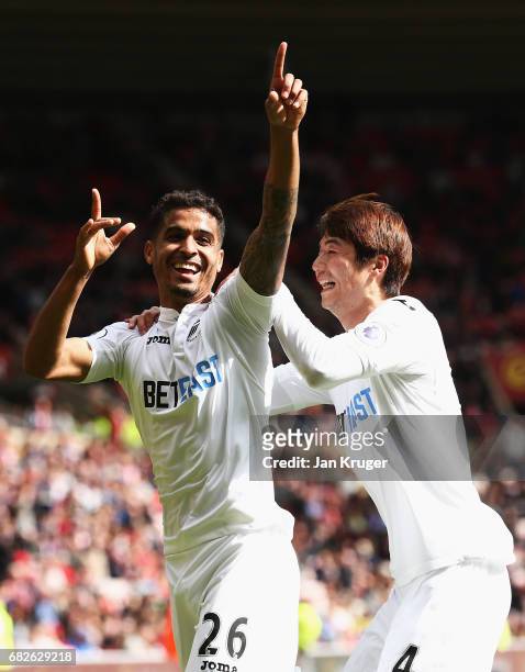 Kyle Naughton of Swansea City celebrates scoring his sides second goal with Ki Sung-Yueng of Swansea City during the Premier League match between...