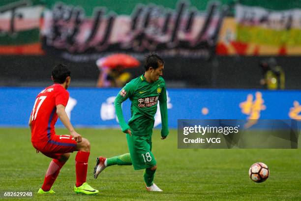 Jin Taiyan of Beijing Guoan follows the ball during the 9th round match of 2017 Chinese Football Association Super League between Yanbian Fude and...