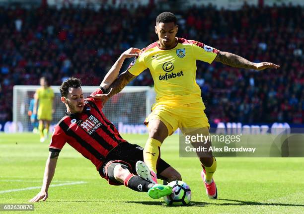 Charlie Daniels of AFC Bournemouth tackles Andre Gray of Burnley during the Premier League match between AFC Bournemouth and Burnley at Vitality...