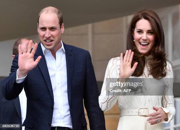 Britain's Prince William, Duke of Cambridge, and Britain's Catherine, Duchess of Cambridge, wave as they host a Special Garden Party at Buckingham...