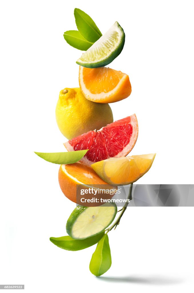Assorted citrus fruits stack still life.