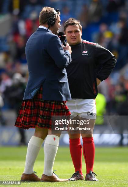 Scott Quinnell interviews Jamie George of Saracens prior to the European Rugby Champions Cup Final between ASM Clermont Auvergne and Saracens at...