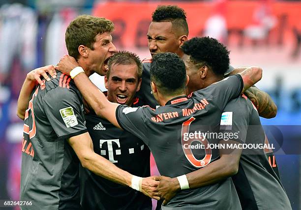 Bayern Munich's players celebrate at the end of the German first division Bundesliga football match between RB Leipzig and FC Bayern Munich on May...