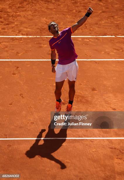 Rafael Nadal of Spain celebrates defeating Novak Djokovic of Serbia in the semi finals during day eight of the Mutua Madrid Open tennis at La Caja...