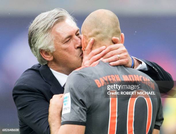 Munich´s head coach Carlo Ancelotti kisses scorer Dutch midfielder Arjen Robben after his goal during the German first division Bundesliga football...