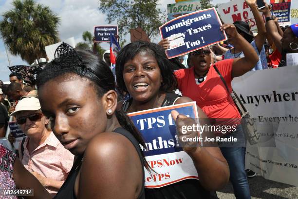 People protest the possibility that the Trump administration may overturn the Temporary Protected Status for Haitians in front of the U.S....