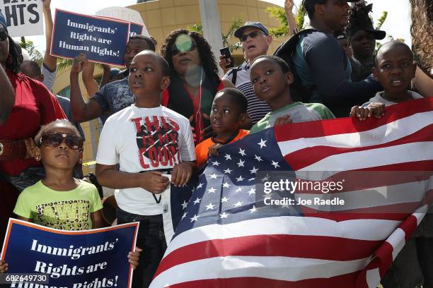 People protest the possibility that the Trump administration may overturn the Temporary Protected Status for Haitians in front of the U.S....