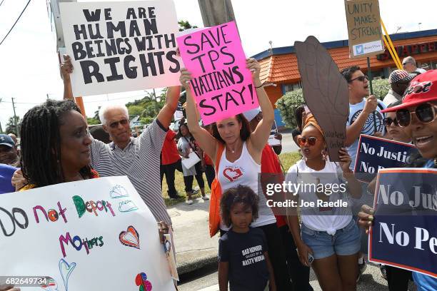 People protest the possibility that the Trump administration may overturn the Temporary Protected Status for Haitians in front of the U.S....