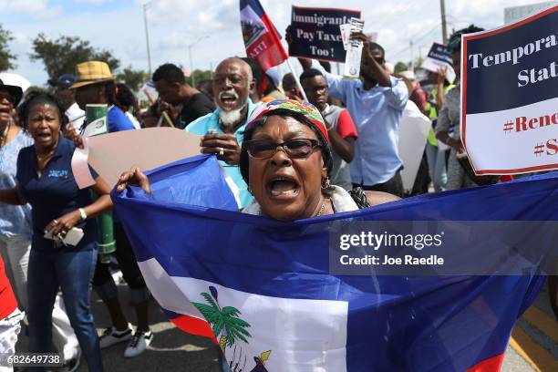 People protest the possibility that the Trump administration may overturn the Temporary Protected Status for Haitians in front of the U.S....