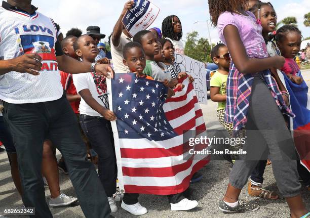 People protest the possibility that the Trump administration may overturn the Temporary Protected Status for Haitians in front of the U.S....