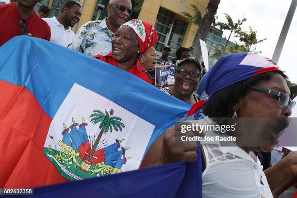 People protest the possibility that the Trump administration may overturn the Temporary Protected Status for Haitians in front of the U.S....