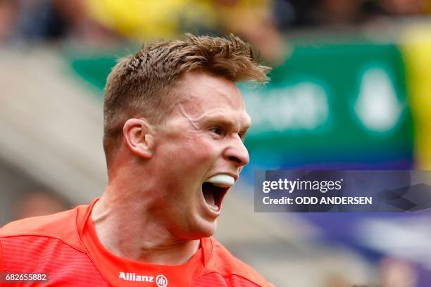 Saracens' English wing Chris Ashton celebrates after scoring the opening try during the rugby union European Champions Cup Final match between...