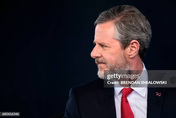 President of Liberty University Jerry Falwell, Jr. Waits to speak during Liberty University's commencement ceremony May 13, 2017 in Lynchburg,...